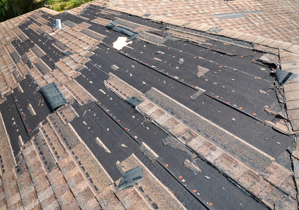 Damaged Asphalt Shingles Removed by Storm