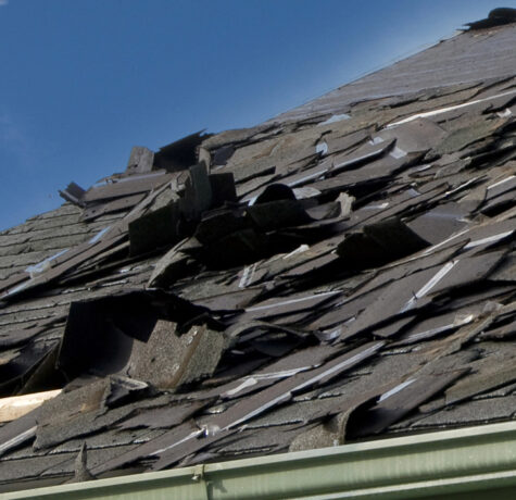 Loose Asphalt Singles on Roof Needing Roof Replacement