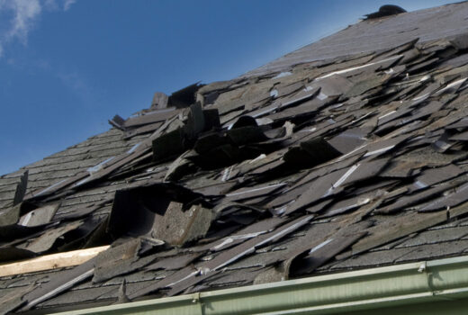 Loose Asphalt Singles on Roof Needing Roof Replacement